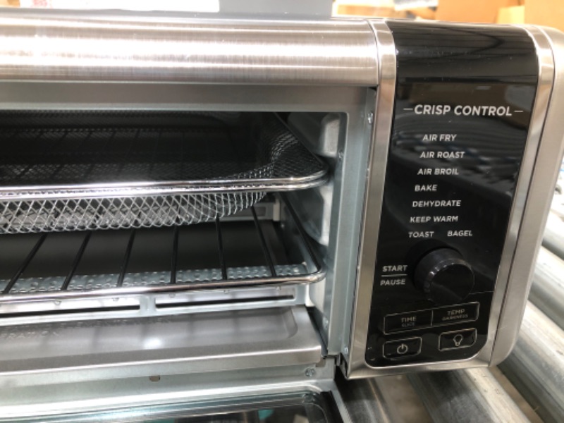 Photo 3 of Ninja SP101 Digital Air Fry Countertop Oven with 8-in-1 Functionality, Flip Up & Away Capability for Storage Space, with Air Fry Basket, Wire Rack & Crumb Tray, Silver
