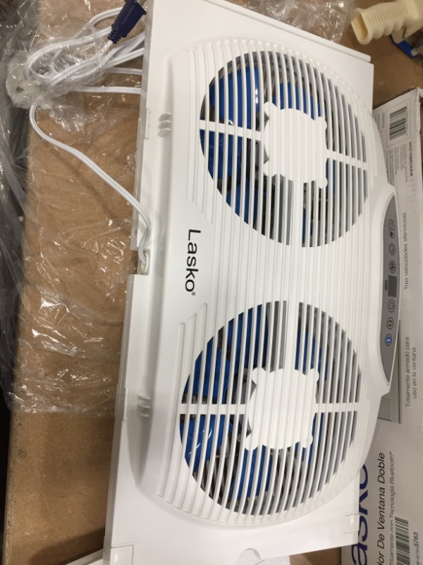 Photo 2 of **DID NOT TURN ON** Lasko W09560 Bluetooth Enabled Twin 9-Inch Window Fan with Independent Electrically Reversible Intake & Exhaust Motors with Thermostat and Timer for Bedroom Indoor Home Use, White

