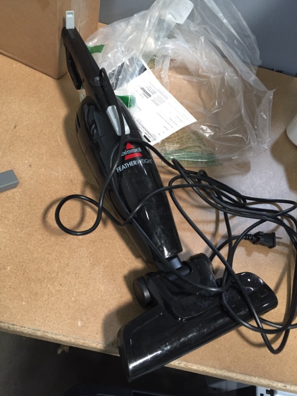 Photo 2 of *USED*
*MISSING pole/ handle*
BISSELL Featherweight Stick Lightweight Bagless Vacuum with Crevice Tool, 2033M, Black
