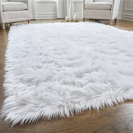 Photo 1 of 58" x 83" white fuzzy carpet