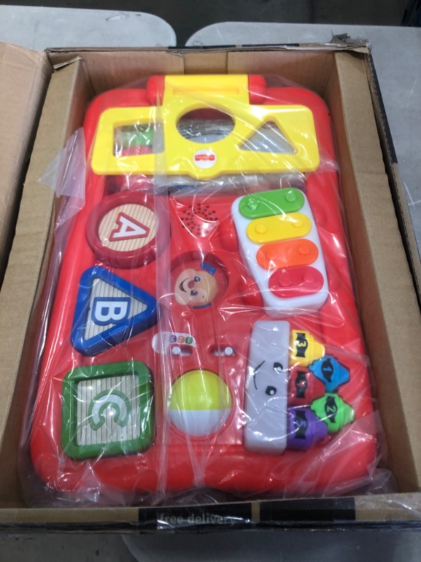 Photo 1 of Fisher-Price Laugh & Learn Pull & Play Learning Wagon, pull-toy wagon with music, lights, and learning songs for babies & toddlers ages 6-36 months
