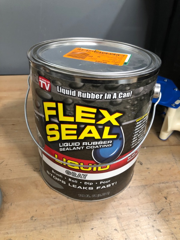 Photo 1 of **can has a dent ** FLEX SEAL FAMILY OF PRODUCTS Flex Seal Liquid Gray 1 Gal. Liquid Rubber Sealant Coating