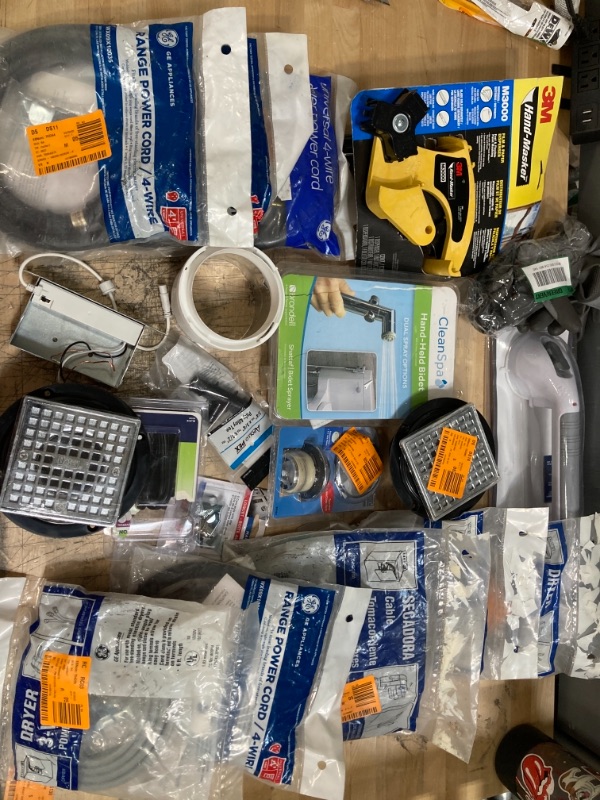 Photo 1 of **NON-REFUNDBALE** 
Miscellaneous Home Depot Items, Assorted Bath and shower Supplies, Dryer Cords, Bath Spouts, Fuzes, locks, Drain Openings 