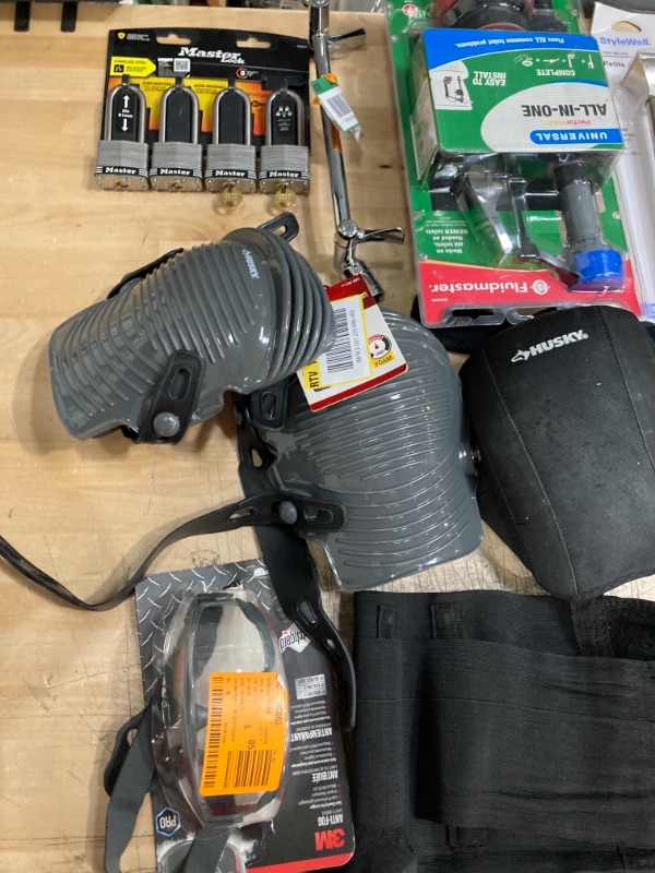 Photo 4 of **NON-REFUNDBALE** 
Miscellaneous Home Depot Items, Assorted Bath Supplies, Locks, Knee Pads and Back Brace, Curtain Rod, Goggles and Saw Blade 