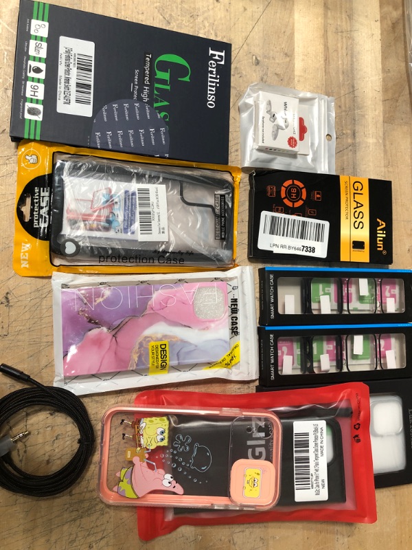 Photo 1 of **NOT REFUNDABLE** BUNDLE OF ASSORTED MISC Phone cases, and tech items
Ear hooks, Audio stereo Cable , Screen glass protector
Phone cases for: iPhone, samsung, smart watches. 