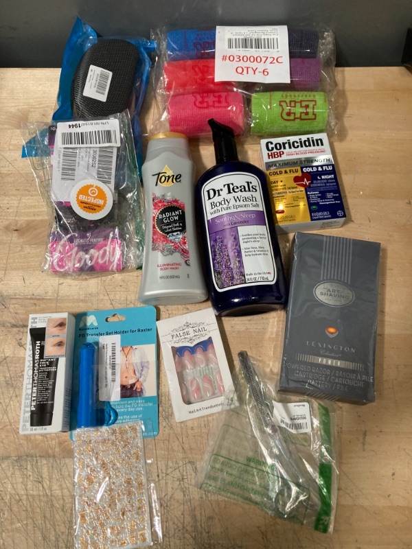 Photo 1 of **NON-REFUNDABLE**
Assortment of Health and Beauty Items; Body wash, Hair Trimmers, Hartis, Nail Accessories, Glasses Case and Medicine. 
Medicine EXP: 06/22