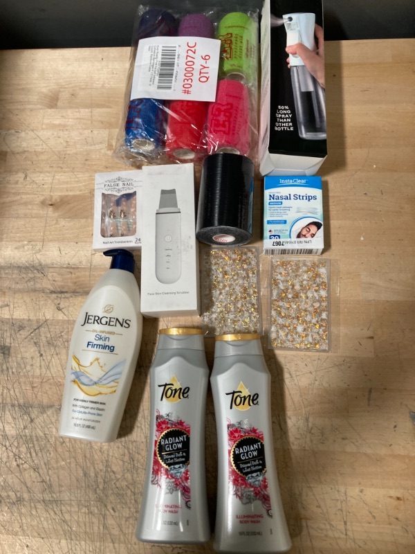 Photo 1 of **NON-REFUNDABLE**
Assortment of Health and Beauty Items; Body wash, Sports Tape, Nail Accessories, Pore Extractor, Spray Bottle and Nasal Strips 