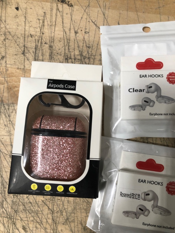 Photo 1 of BUNDLED BAG OF EAR HOOKS/AIRPOD CASE 