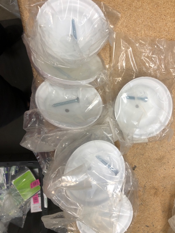 Photo 1 of **7 COUNT** - 4 in. Plastic Bell Cleanout Cover Plate in White
