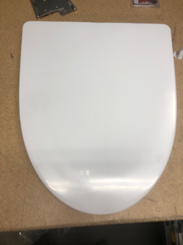 Photo 1 of **UNKNOWN BRAND** - Elongated toilet seat cover