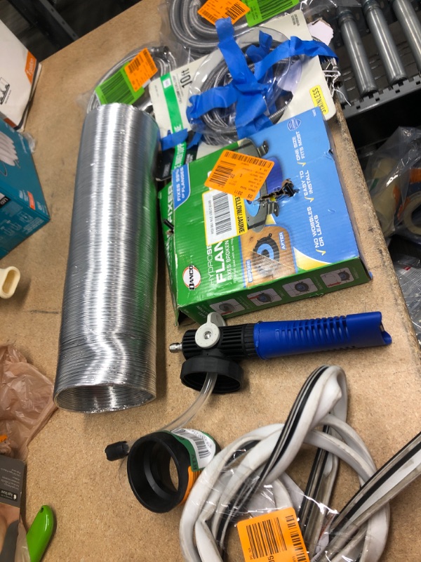 Photo 1 of **NO REFUNDS/RETURNS** - Bundle of Miscellaneous bag of washing machine hose, water supply connectors, danco, ect. 