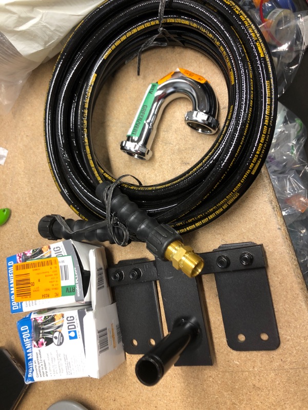 Photo 1 of **NO REFUNDS/RETURNS** - Bundle of Miscellaneous home depot goods: semi ridge duct, dewalt hose, sprinklers system, etc. 