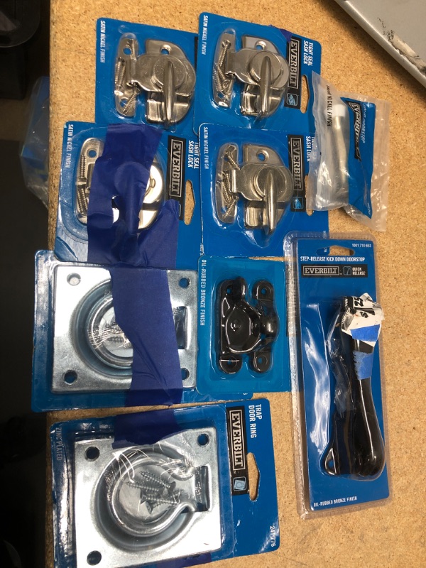 Photo 1 of **NO REFUNDS/RETURNS** - Bundle of ASSORTED SASH LOCKS, DOORSTOPPERS