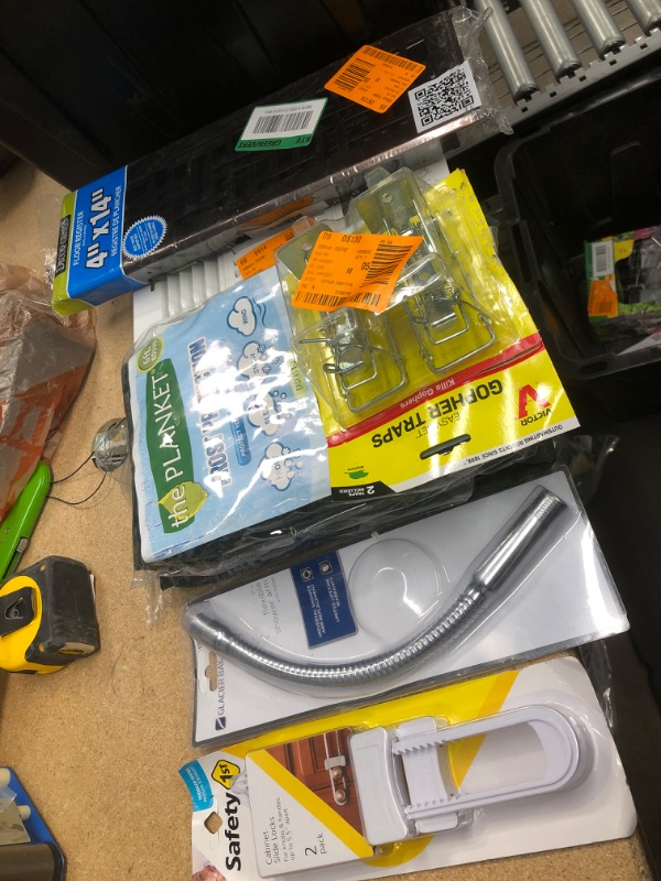 Photo 1 of **NO REFUNDS/RETURNS** - Bundle of Miscellaneous home goods: safety cabinet locks, shower arm, blanket for plants (2)