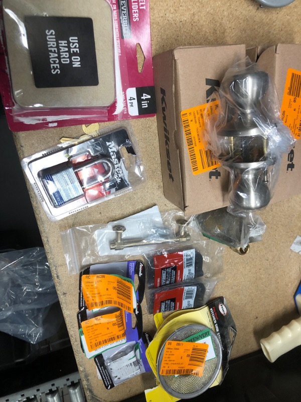 Photo 1 of **NO REFUNDS/RETURNS** - Bundle of Miscellaneous Home Depot Goods: door knobs, felt sliders, master lock, hinges, etc.