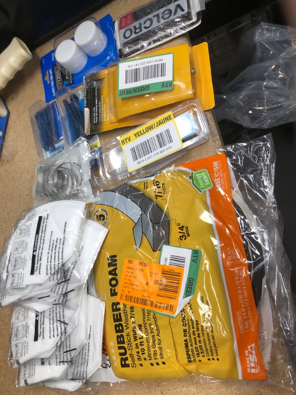 Photo 1 of **NO REFUNDS/RETURNS** - Bundle of Miscellaneous Home depot goods: masks, screws, rubber foam 