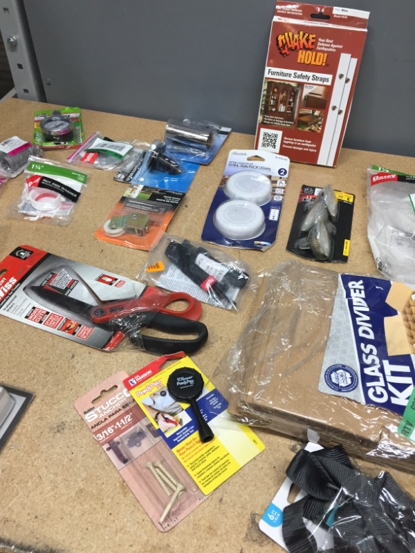 Photo 4 of ***non-refundable**
assorted household goods
furniture straps, fire starter squares, shears, lights and plumbing goods