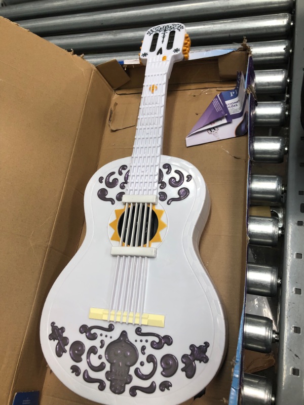 Photo 3 of ?Disney Pixar Coco Guitar, Playable Musical Toy with Chord Chart, Approx 25-in Long for Kids Ages 3 Years Old & Up