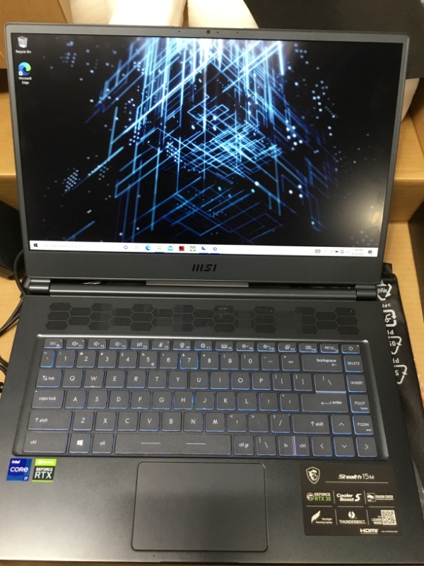 Photo 2 of MSI Stealth 15M Gaming Laptop: 15.6" 144Hz FHD 1080p Display, Intel Core i7-11375H, NVIDIA GeForce RTX 3060, 16GB, 512GB SSD, Thunderbolt 4, WiFi 6, Win10, Carbon Gray (A11UEK-009)
