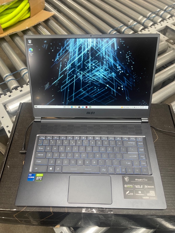 Photo 2 of MSI Stealth 15M Gaming Laptop: 15.6" 144Hz FHD 1080p Display, Intel Core i7-11375H, NVIDIA GeForce RTX 3060, 16GB, 512GB SSD, Thunderbolt 4, WiFi 6, Win10, Carbon Gray (A11UEK-009)