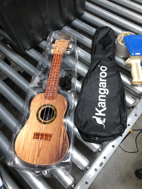 Photo 2 of **INCOMPETE**
Kangaroo 22.5" Ukulele with Electronic Tuner, Strap, Picks, Carrying Case & Songbook
