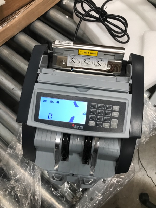 Photo 2 of **DAMAGED**
Cassida 5520 UV/MG - USA Money Counter with ValuCount, UV/MG/IR Counterfeit Detection, Add and Batch Modes - Large LCD Display & Fast Counting Speed 1,300 Notes/Minute
