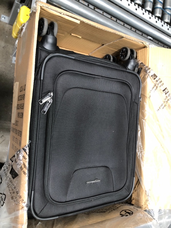 Photo 1 of USED: Amazon Basics Expandable Softside Carry-On Spinner Luggage Suitcase With TSA Lock And Wheels - 23 Inch, Black
