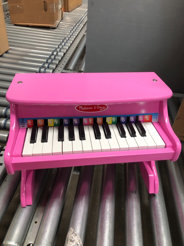 Photo 2 of Melissa & Doug Learn-to-Play Pink Piano With 25 Keys and Color-Coded Songbook