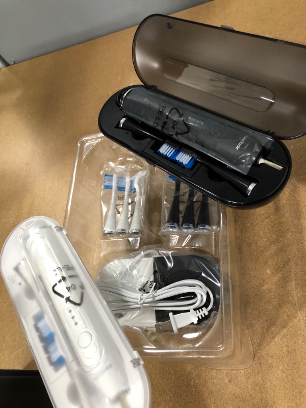 Photo 2 of AquaSonic Duo Dual Handle Ultra Whitening 40,000 VPM Wireless Charging Electric ToothBrushes - 3 Modes with Smart Timers - 10 Dupont Brush Heads & 2 Travel Cases Included
