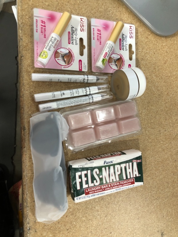 Photo 1 of **NO REFUNDS/RETURNS** - Bundle of assorted home goods kiss lash glue, NYC, soap, etc. 