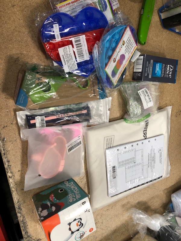 Photo 1 of **NO REFUNDS/RETURNS** - Bundle of Miscellaneous  Amazon Goods for home and kids- bubble fidget toys, dove men care, table cloth, etc. 
