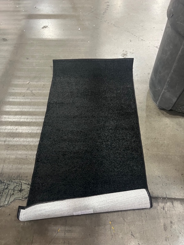 Photo 2 of  2' x 4', black rug 