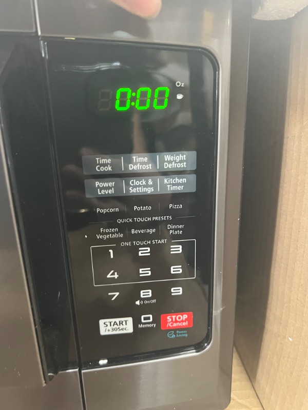 Photo 4 of Toshiba EM925A5A-BS Microwave Oven with Sound On/Off ECO Mode and LED Lighting, 0.9 Cu Ft/900W, Black Stainless Steel
BUTTONS DO NOT FUNCTION
