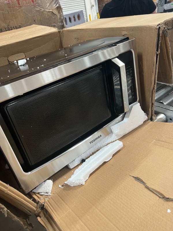 Photo 3 of Toshiba ML-EC42P(SS) Multifunctional Microwave Oven with Healthy Air Fry, Convection Cooking, Smart Sensor, Easy-to-Clean Interior and ECO Mode, 1.5 Cu.ft, Black Stainless Steel
**** dented in the front***