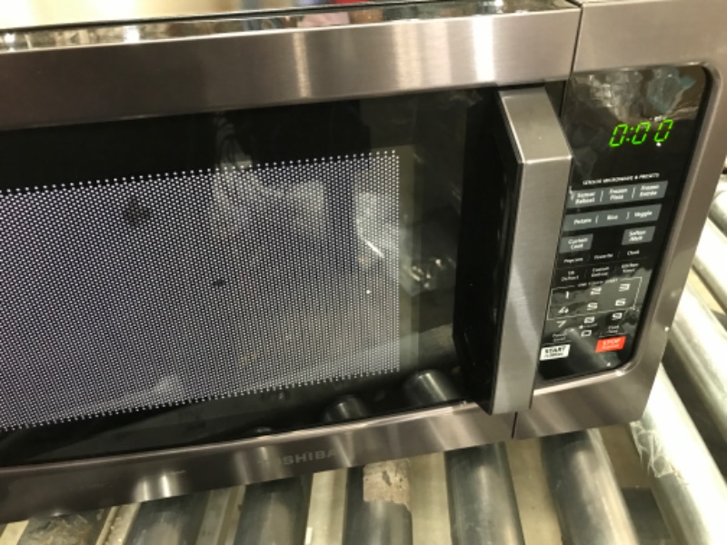 Photo 2 of Toshiba EM131A5C-BS Microwave Oven with Smart Sensor, Easy Clean Interior, ECO Mode and Sound On/Off, 1.2 Cu Ft, Black Stainless Steel
MISSING COMPONENTS 