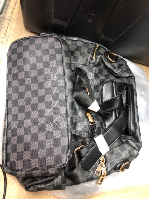 Photo 2 of grey and black checkered backpack purse