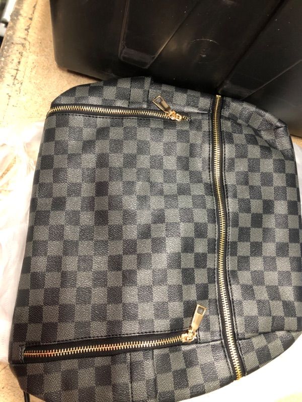 Photo 2 of grey and black checkered backpack purse