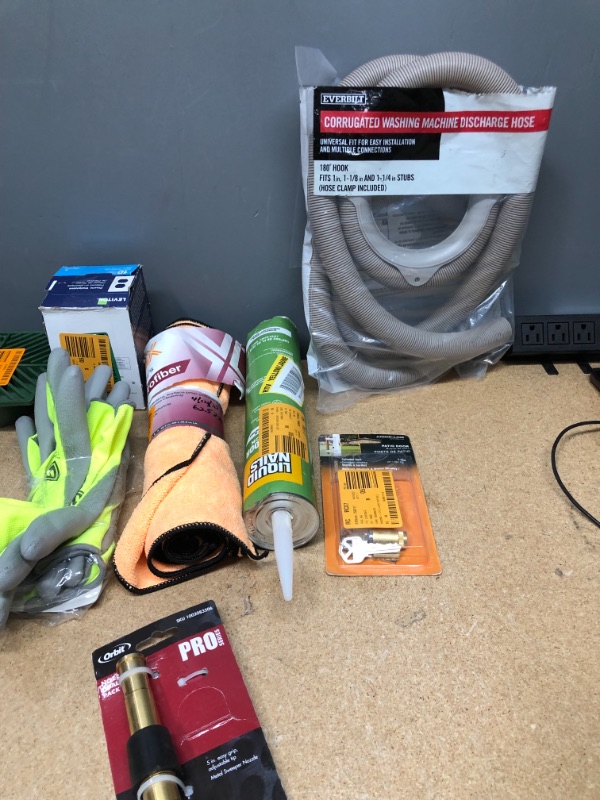 Photo 3 of **NON-REFUNDABLE**
ASSORTED HOME GOODS
DUAL NOZZLE, HUSKEY GLOVES, LED 60 WATT BULBS, PLASTIC WALL PLATES,WASHING MACHINE DISCHARGE HOSE