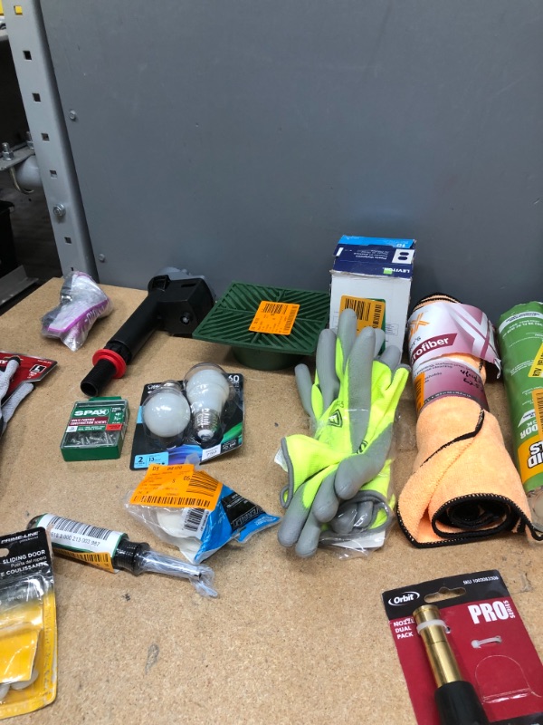 Photo 2 of **NON-REFUNDABLE**
ASSORTED HOME GOODS
DUAL NOZZLE, HUSKEY GLOVES, LED 60 WATT BULBS, PLASTIC WALL PLATES,WASHING MACHINE DISCHARGE HOSE