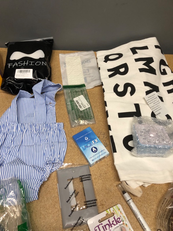 Photo 1 of ***non-refundable**
assorted house hold goods 
belt, laundry bag, egg timer, light bulb,socks,2 hoop slip,jumbo eye pencil. purse(damaged)