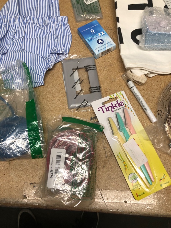 Photo 8 of ***non-refundable**
assorted house hold goods 
belt, laundry bag, egg timer, light bulb,socks,2 hoop slip,jumbo eye pencil. purse(damaged)