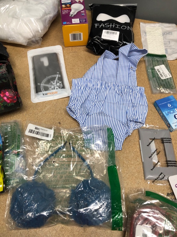 Photo 3 of ***non-refundable**
assorted house hold goods 
belt, laundry bag, egg timer, light bulb,socks,2 hoop slip,jumbo eye pencil. purse(damaged)