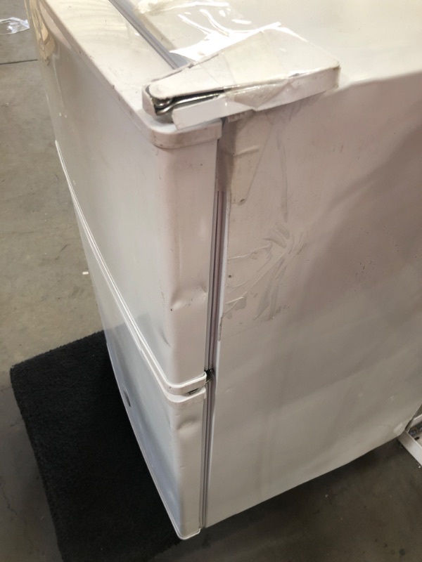 Photo 2 of **DAMAGED** GE 3.1 Cu Ft Double-Door Compact Refrigerator GDE03GGKWW, White