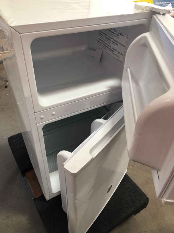 Photo 4 of **DAMAGED** GE 3.1 Cu Ft Double-Door Compact Refrigerator GDE03GGKWW, White