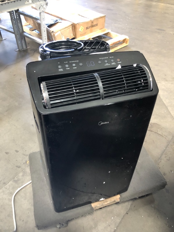 Photo 1 of TESTED TURNS ON**
Midea Duo 14,000 BTU (12,000 BTU SACC) Smart HE Inverter Ultra Quiet Portable Air Conditioner With Heat-Cools Up to 550 Sq. Ft