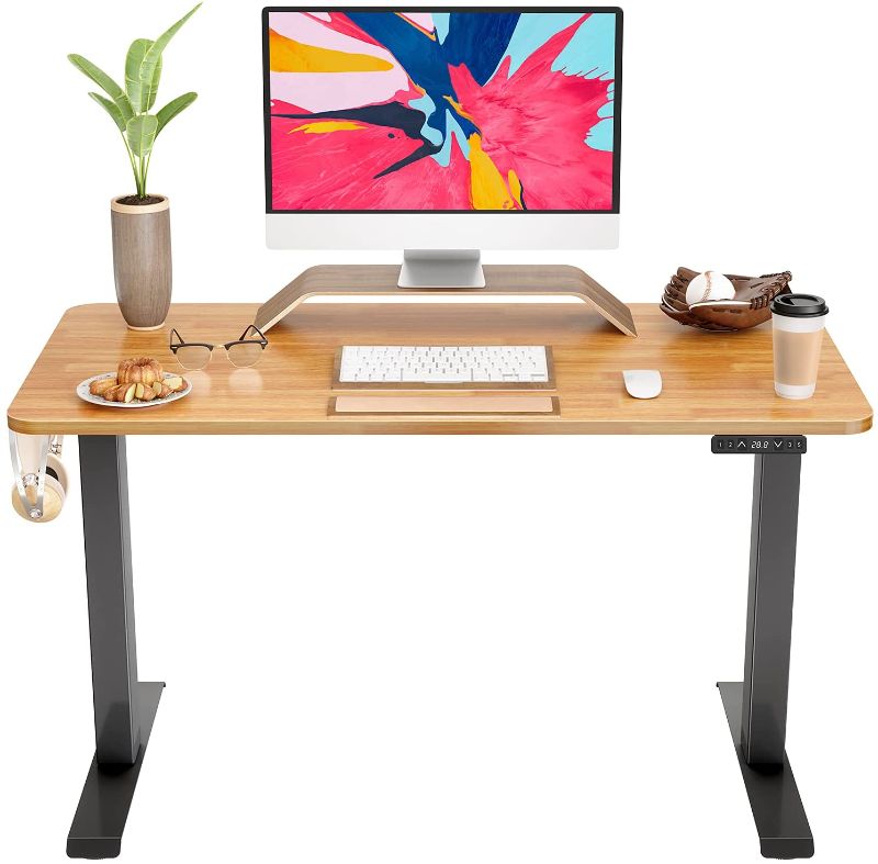 Photo 1 of FAMISKY Standing Desk Dual Motors, Adjustable Height Electric Stand up Desk, 40 x 24 Inches Sit Stand Home Office Desk, Ergonomic Workstation Black Steel Frame/Bamboo Wood Grain Tabletop
