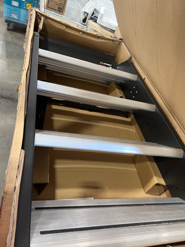 Photo 1 of Lippert 791575 SolidStep Fold-Down RV Premium Quad Steps - 29-36" Width