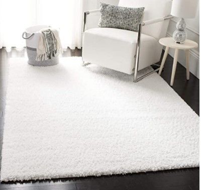 Photo 1 of Safavieh August Shag Collection AUG900A Solid 1.2-inch Thick Area Rug, 5'3" x 7'6", White
