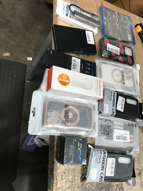 Photo 1 of MISCELLANEOUS BUNDLE OF ASSORTED PHONE CASES AND OTHER ELECTRICAL GOODS