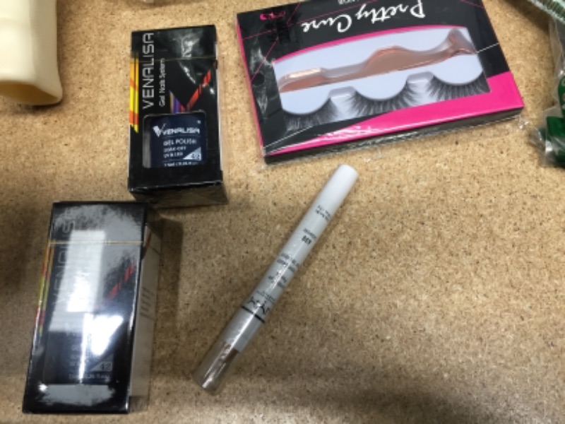 Photo 4 of NON-REFUNDABLE BAG OF ASSORTED MAKEUP
eyelash glue, nail polish, lotion and more 